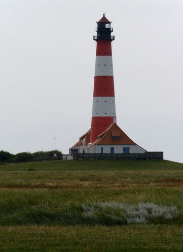 A vertical shot of Westerhever lighthouse in North Frisian Wadden Sea Pellworm Germany