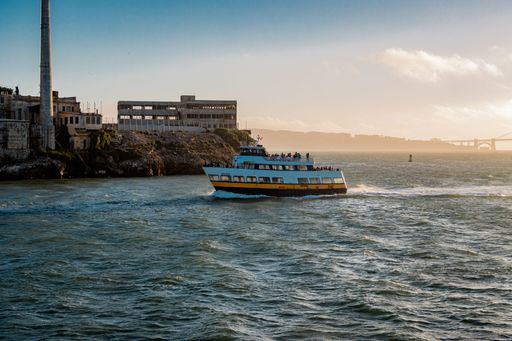 A scenic shot of a small ferry boat on the coast of San Francisco in California, USA