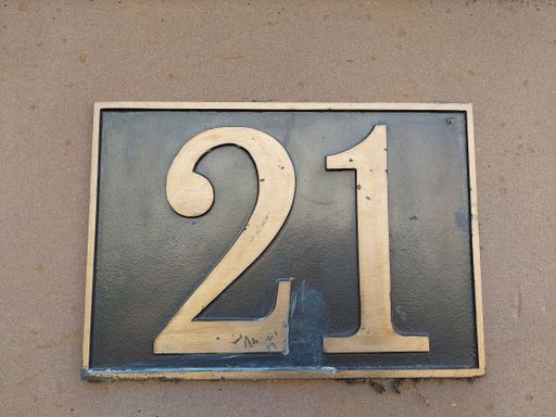 A closeup shot of a house number 21