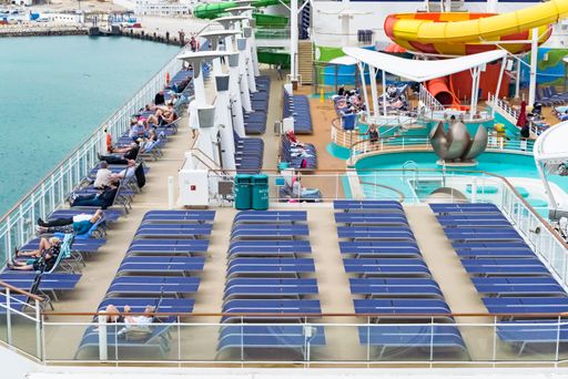 Tourists on deck of a luxury cruise liner against coastline of Morocco , image for travel tourism concept