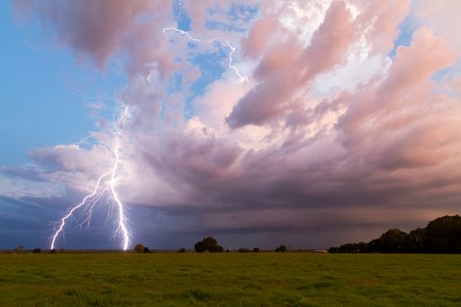 A scenic view of beautiful lightning over the field