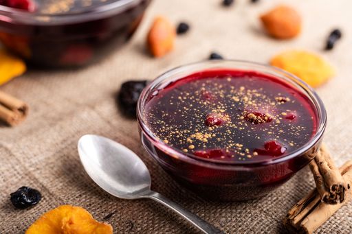 The Peruvian purple jam dessert called mazamorra morada with dried fruits and cinnamon