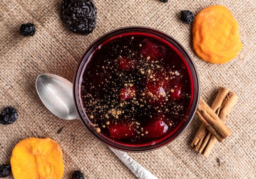 A top view of a mazamorra morada and cinnamon sticks