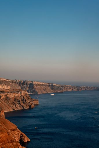 A vertical shot of a coastline in Santorini
