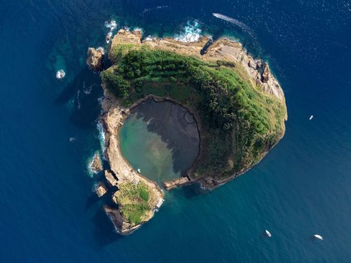 A bird's eye view shot of the Ilheu de Vila Franca do Campo, the crater of an old underwater volcano