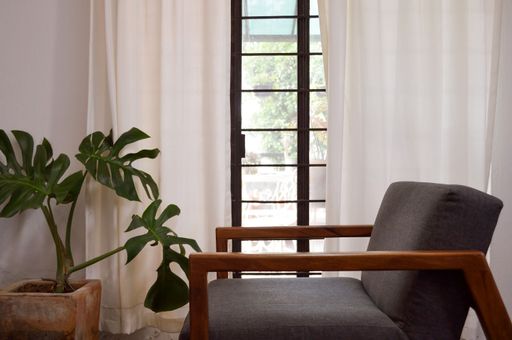 A cozy armchair by the window in a room