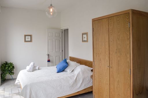 a minimalistic bedroom furniture with a wooden wardrobe
