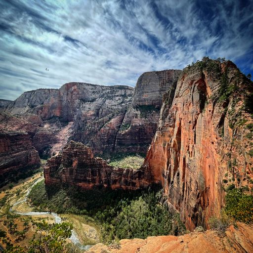 A mesmerizing view of Angels Landing under a beautiful cloudy sky at the Zion National Park in Utah