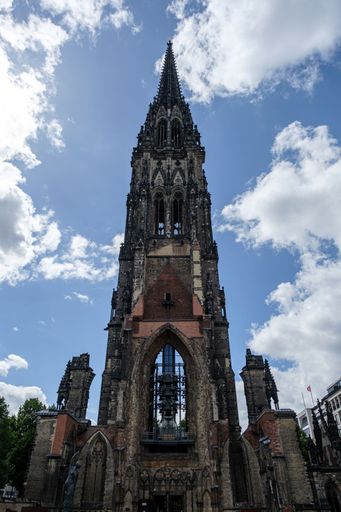 A vertical shot of St. Nikolai Memorial under a cloudy sky, Hamburg