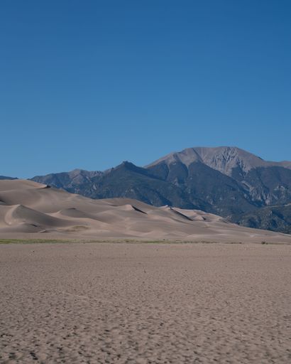A vertical shot of Great Sand Dunes National Park and Preserve under the sunlight in Colorado