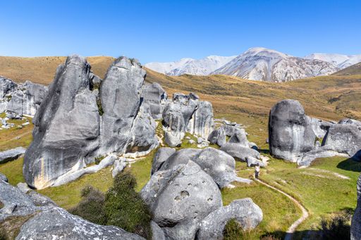 People Walking Amongst Natural Rock Formations in the Castle Hill Conservation Area, near Christchurch, New Zealand.