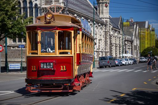 Street Tram turning onto Rolleston Avenue in front of The Arts Centre in Christchurch, New Zealand.