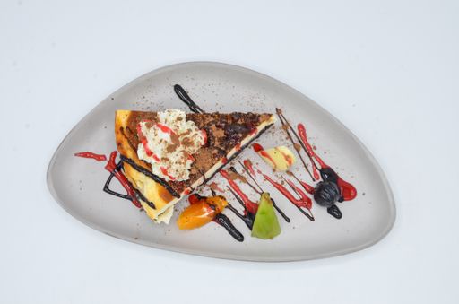 A closeup shot of a cheescake with fruits