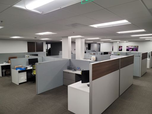 An interior of a big comfortable empty office with white lights