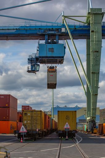 Andernach, Rhineland Palatinate, Germany - October 25, 2019: in a container terminal a container is lifted by a crane bridge