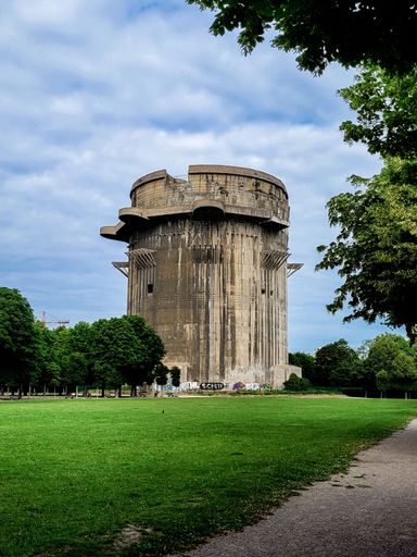A vertical of the anti-aircraft Flak tower under a cloudy sky in Vienna, Austria