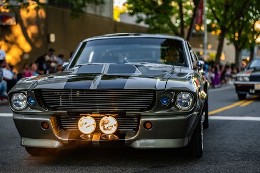 A retro Ford mustang on road