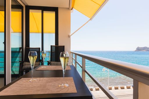 A view from an outdoor restaurant to the beautiful nature of beach Albir, Spain