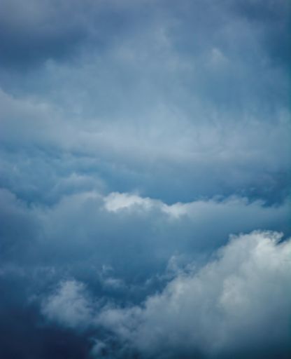 A vertical shot of a blue cloudy sky - perfect for wallpapers and backgrounds