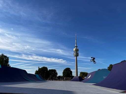 A BMX tournament at European Championships with bike rider jumping in slow motion