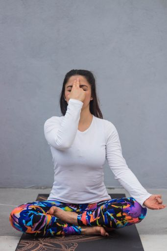 A shallow focus shot of a female doing yoga exercises