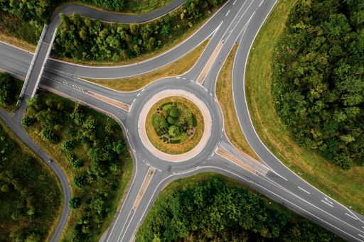 An aerial drone shot of an empty roundabout