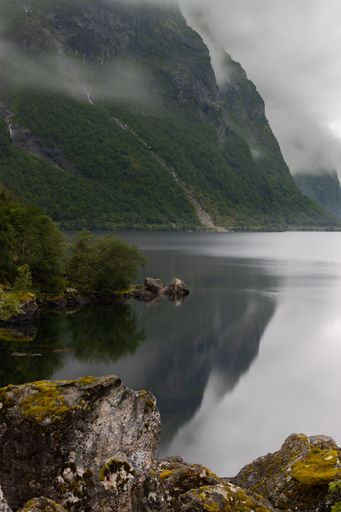 A clear clam lake near the mountain in Norway