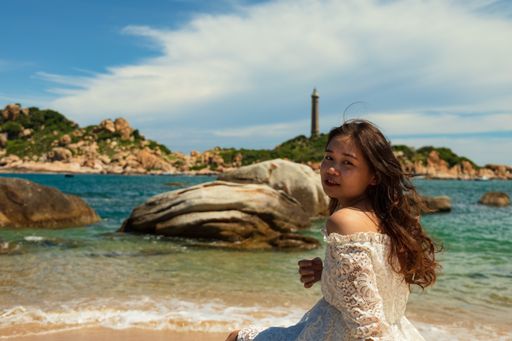 A pretty Asian girl near the beach of Hai Dang Mui Ke Ga Ke in Vietnam