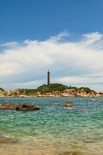 A vertical shot of rocky coast near Hai Dang Mui Ke Ga Ke under blue sky in Vietnam