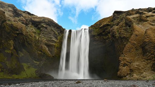 A scenic view of the beautiful Skogafoss waterfall located in Iceland
