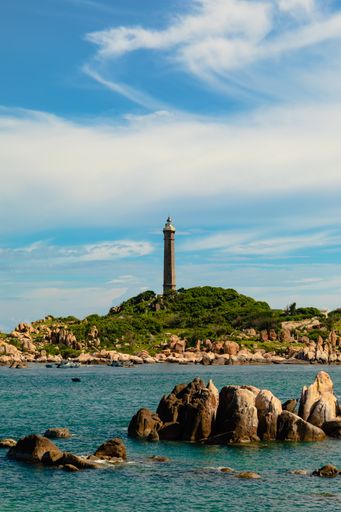 A vertical shot of a lighthouse in Khe Ga island, Vietnam
