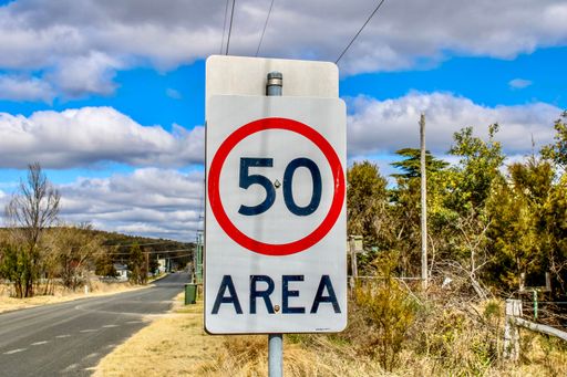 A 50km Area sign on the road