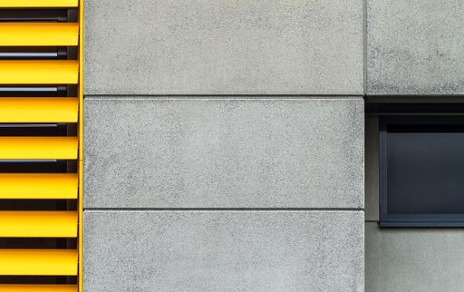 A concrete wall texture next to a window