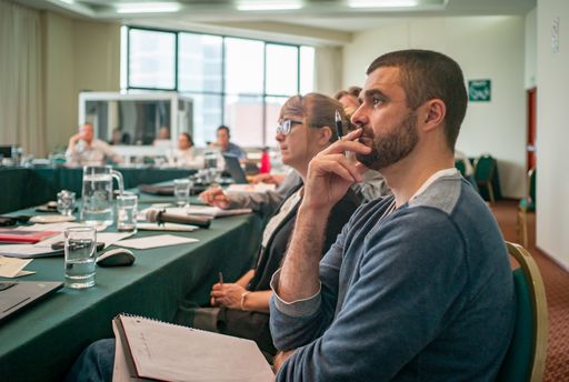 Lima / Peru - December 1 2016: Group of People Sitting in a Business Training, Listening and Taking Notes