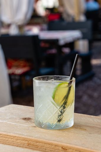 A vertical shot of a Mai Tai rum cocktail on a wooden table