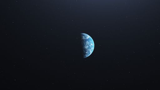 The planet earth from space at the centre on a dark background