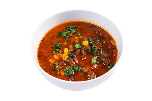 A closeup of a red vegetable soup served in a bowl isolated on white background