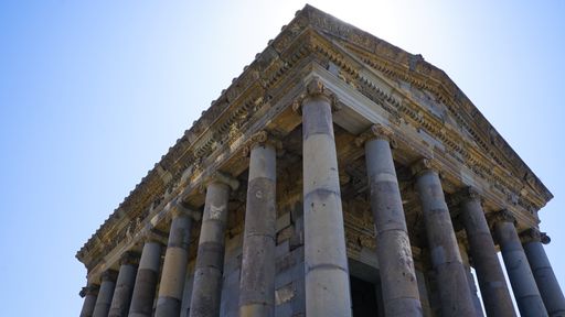 A low angle shot of the Peripteros temple in Garni, Armenia