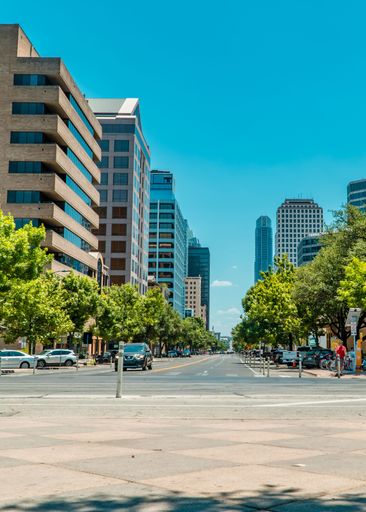 A vertical shot of the Congress Avenue in central Austin, Texas