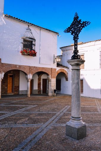 A vertical shot of the historic courtyard of Plaza Chica de Zafra in Badajoz, Spain