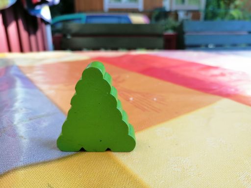 A selective focus shot of a wooden toy trees