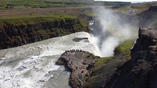 A scenic view of the Gullfoss Falls on a sunny day in the canyon of the Hvita river in southwest Iceland
