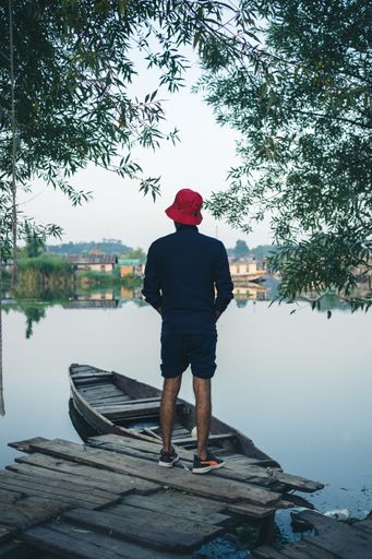 A man get ready to take a Shikara ride in Dal Lake.