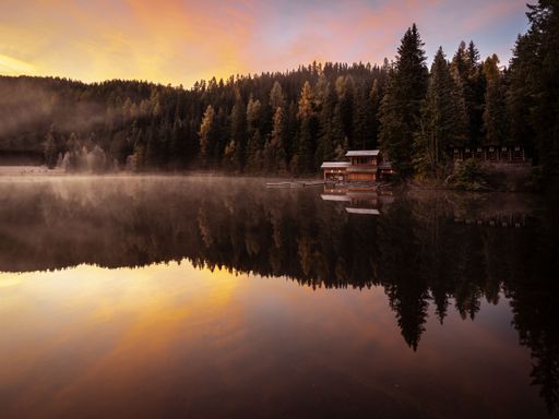 Mountainlaike Prebersee in the Austrian Alps at Sunset in the Morning with Fog and rich colors. Shot in the fall autumn with a bit of snow.