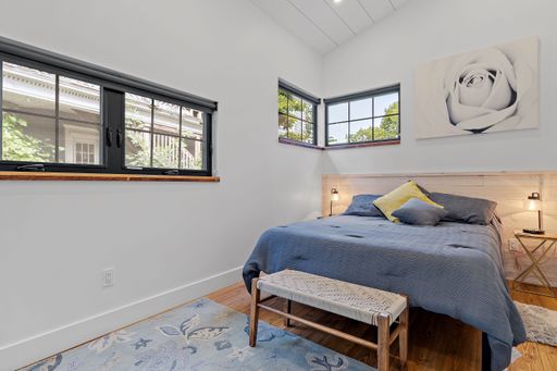 A beautiful shot of a modern bedroom with white brick walls