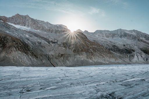 A beautiful shot of the snowy rocky mountains under a sunny sky in Fieschertal, Switzerland
