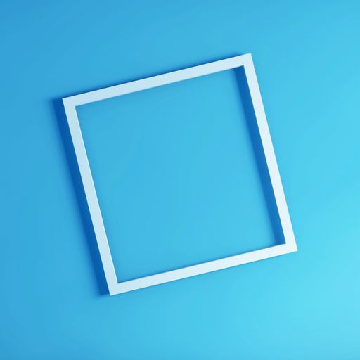 A top view shot of a white frame board on a light blue background