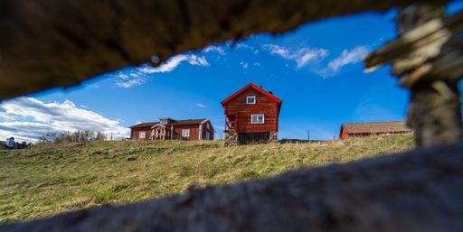 A beautiful shot of a tiny wooden house under the cloudy sky