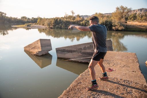 A closeup shot of a male training next to the river