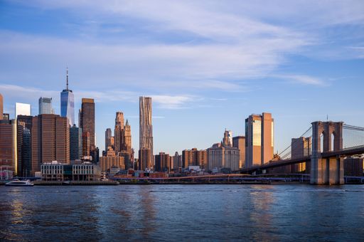 The modern New York city at the river shore on a sunny day
